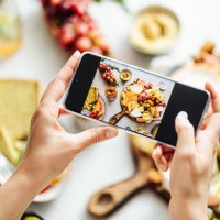 woman photographing fresh meze on table - food stock pictures, royalty-free photos & images