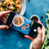woman photographing pumpkin pasta dish - food stock pictures, royalty-free photos & images