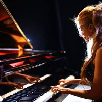 woman playing piano in a concert. - concert stock pictures, royalty-free photos & images