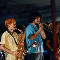 woman playing the saxophone at an outdoor music festival - concert stock pictures, royalty-free photos & images