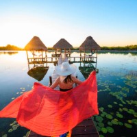 woman playing with red sarong on a pier, mexico - travel stock pictures, royalty-free photos & images