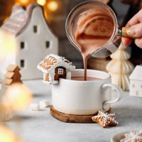 woman pouring hot chocolate in mug on table. - home decoration stock pictures, royalty-free photos & images