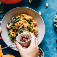 woman preparing autumn pumpkin meal - food stock pictures, royalty-free photos & images