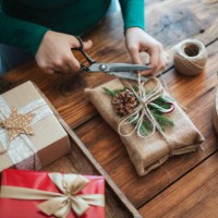 woman preparing christmas gift in rustic style with zero waste materieals. - home decoration stock pictures, royalty-free photos & images