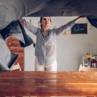 woman preparing dinner table - home decoration stock pictures, royalty-free photos & images