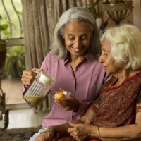 woman preparing pani puri for her old friend - junk food stock pictures, royalty-free photos & images