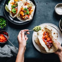 woman preparing tasty vegan tacos - food stock pictures, royalty-free photos & images