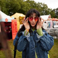 woman puckering while wearing red sunglasses - concert stock pictures, royalty-free photos & images