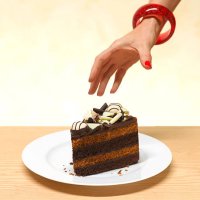 woman reaching for a slice of cake - junk food stock pictures, royalty-free photos & images