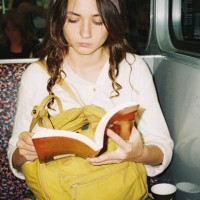 woman reading book in subway - fashion stock pictures, royalty-free photos & images