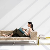 woman reading on a sofa - home decoration stock pictures, royalty-free photos & images
