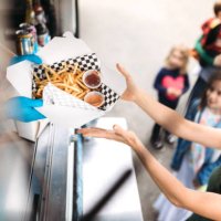 woman receiving order at food truck - junk food stock pictures, royalty-free photos & images