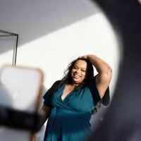 woman recording herself dancing on her phone - fashion stock pictures, royalty-free photos & images