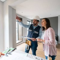 woman remodeling her house and talking to the architect - home decoration stock pictures, royalty-free photos & images