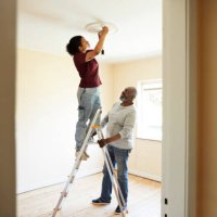 woman renovating home with father - home decoration stock pictures, royalty-free photos & images