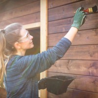 woman repairing a garden house - home decoration stock pictures, royalty-free photos & images