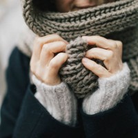 woman's hand holding knitted scarf, close-up - fashion stock pictures, royalty-free photos & images