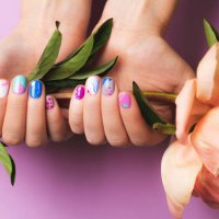 woman's hands with bright manicure holding peony flower - nails art stock pictures, royalty-free photos & images