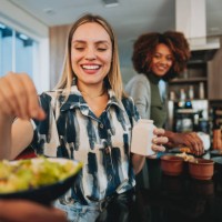 woman seasoning the salad - food stock pictures, royalty-free photos & images