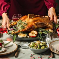woman setting the table for christmas dinner - food stock pictures, royalty-free photos & images