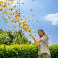 woman shooting party popper - garden decoration stock pictures, royalty-free photos & images
