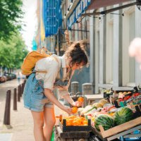woman shopping for fruits in small shop in amsterdam - food stock pictures, royalty-free photos & images
