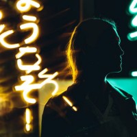 woman silhouette against neon signs at night - concert stock pictures, royalty-free photos & images