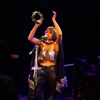 woman singing onstage with band - concert stock pictures, royalty-free photos & images