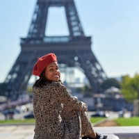 woman sitting in front of the eiffel tower - fashion stock pictures, royalty-free photos & images