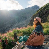 woman sitting on rooftop of camper van overlooking furka pass - travel stock pictures, royalty-free photos & images