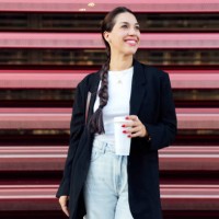 woman standing on the street and drinking coffee - junk food stock pictures, royalty-free photos & images