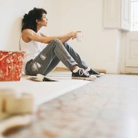 woman taking a break while painting apartment. - home decoration stock pictures, royalty-free photos & images