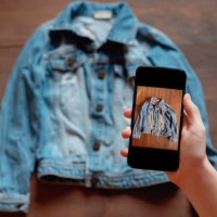 woman taking photo of denim shirt on smartphone - fashion stock pictures, royalty-free photos & images