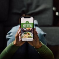 woman using meal delivery mobile app - food stock pictures, royalty-free photos & images