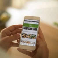 woman using meal delivery service through mobile app. - food stock pictures, royalty-free photos & images