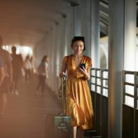 woman using mobile phone at railroad station - travel stock pictures, royalty-free photos & images