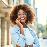 woman using smart phone at sidewalk in city - fashion stock pictures, royalty-free photos & images