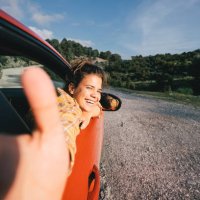 woman video bloger traveling by electric car with a smart phone, recording video stories for social media - travel stock pictures, royalty-free photos & images