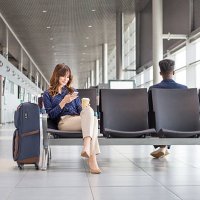woman waiting for flight at the airport lounge - travel stock pictures, royalty-free photos & images