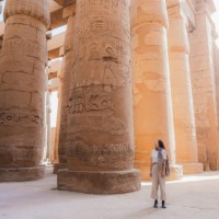 woman walking in the ancient egyptian temple in luxor - travel stock pictures, royalty-free photos & images