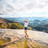 woman walking on the limestone rock formations at hierve el agua, oaxaca, mexico - travel stock pictures, royalty-free photos & images