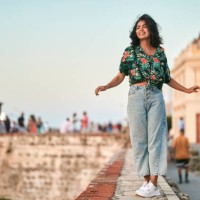 woman walking on wall in cartagena, colombia - fashion stock pictures, royalty-free photos & images