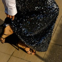 woman wearing party dress made of glowing festive sequined fabric. new year's eve celebration. - fashion stock pictures, royalty-free photos & images