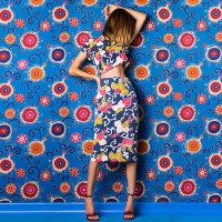 woman wearing print dress against print background - fashion stock pictures, royalty-free photos & images