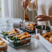 woman weighing lunch boxes as part of healthy meal prep - food stock pictures, royalty-free photos & images