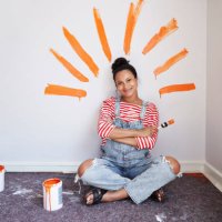 woman with brush strokes on wall renovating home - home decoration stock pictures, royalty-free photos & images