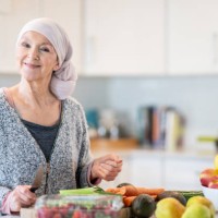 woman with cancer cooks a health meal - food stock pictures, royalty-free photos & images