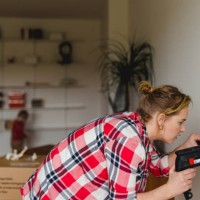 woman with electric drill - home decoration stock pictures, royalty-free photos & images