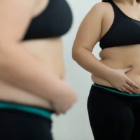 woman with fat abdomen - junk food stock pictures, royalty-free photos & images