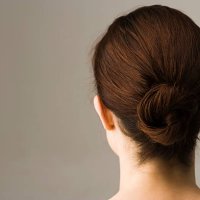 woman with hair arranged in chignon, rear view - hairstyle stock pictures, royalty-free photos & images